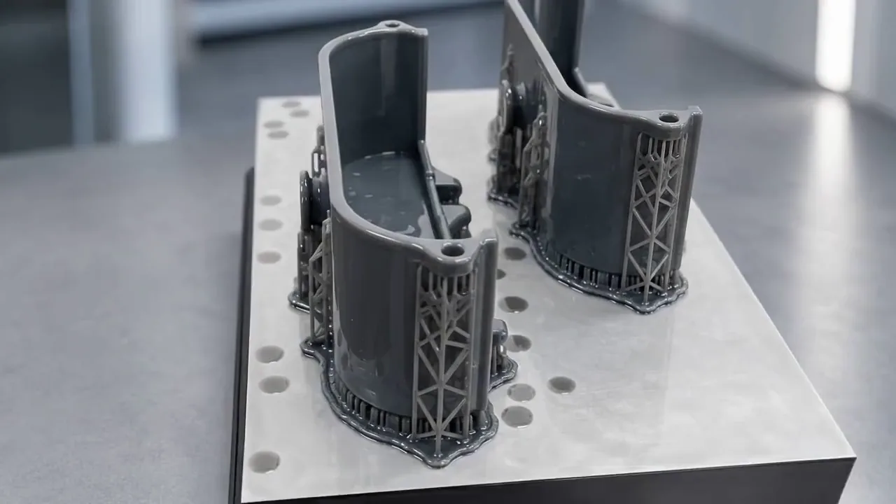 A 3D-printed prototype part on the build plate at Aspetto Labs